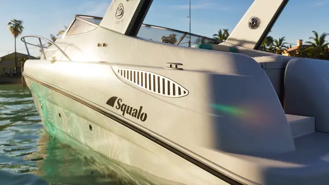 Close-up of a white Shitzu Squalo speedboat's hull and badge on the water