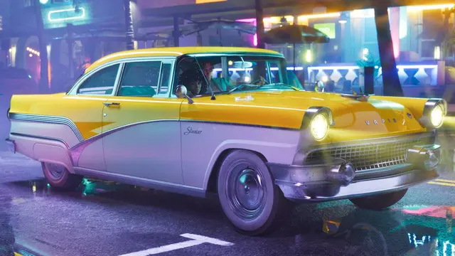 A yellow and white '55 Vapid Stanier under neon lights on a wet street at night