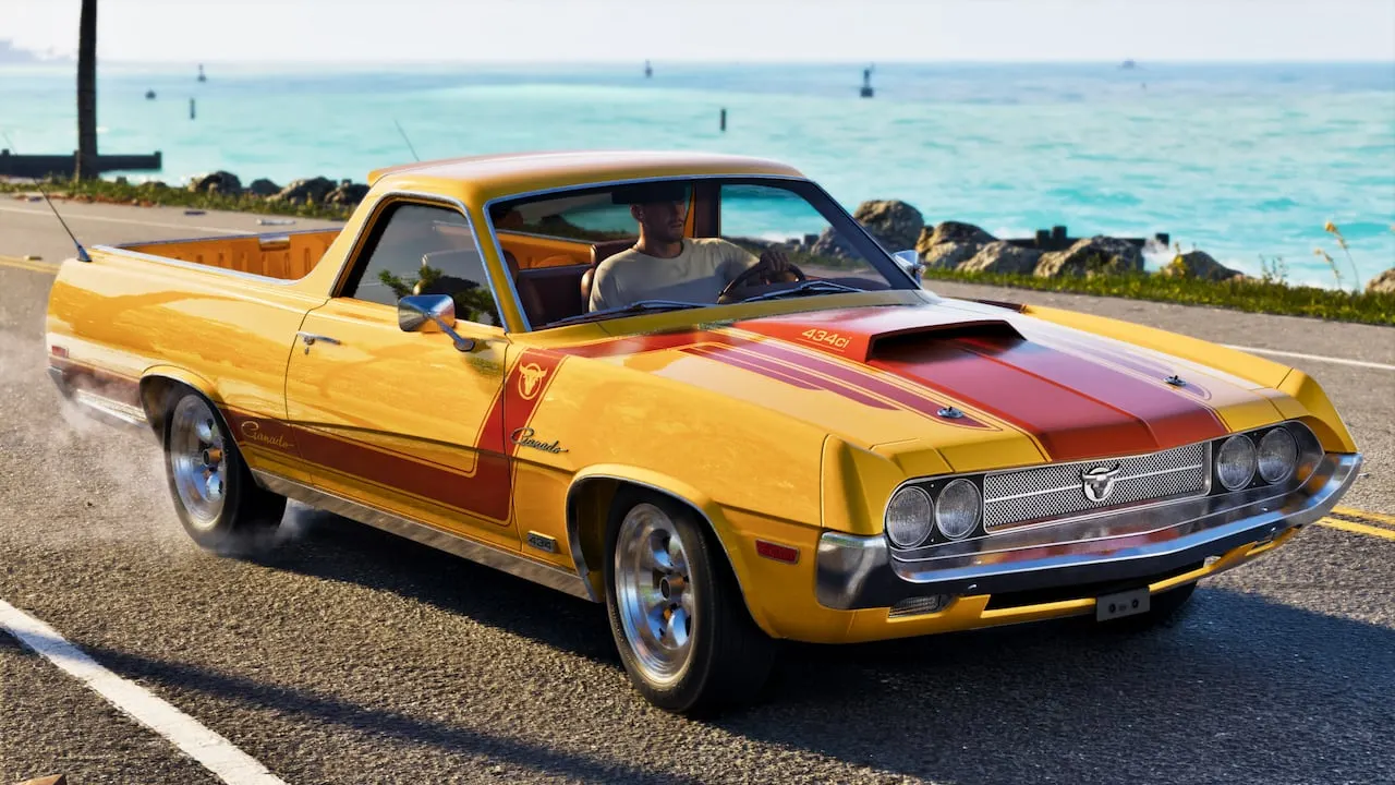 A yellow Vapid Ganado Retro Build with red stripes on a seaside road
